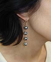 Four Seasons Pearl Earrings - modelled