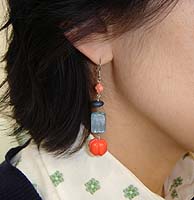 Coral Pumpkin Earrings - modelled